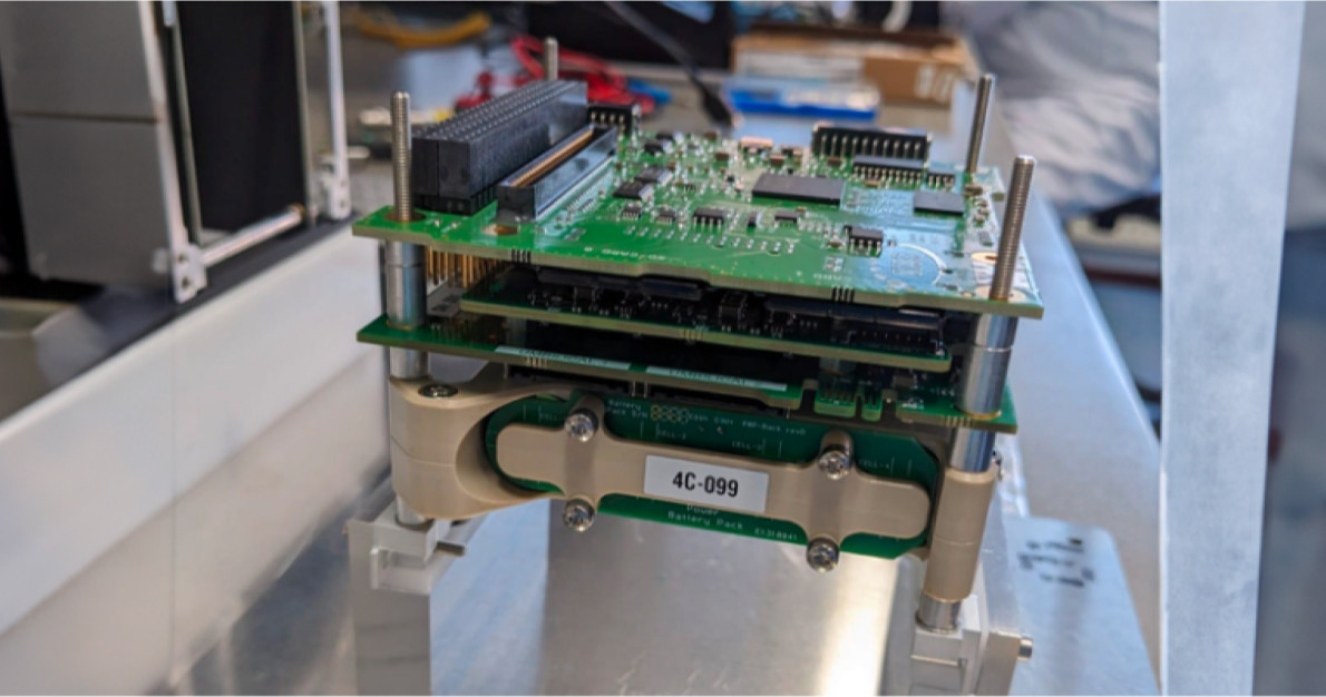 Cryptosat engineers working on a board in the startup’s lab